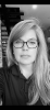 Headshot of Kelly Rabedeau, author on bumper repairs and collision repair topics for 360 Collision, featuring long hair and glasses.