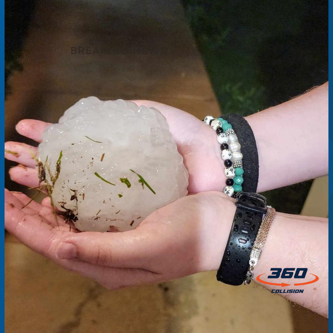 Hailstone held in hands with grass and debris, illustrating hail damage concerns relevant to 360 Collision's auto body repair services after recent storms in San Antonio.